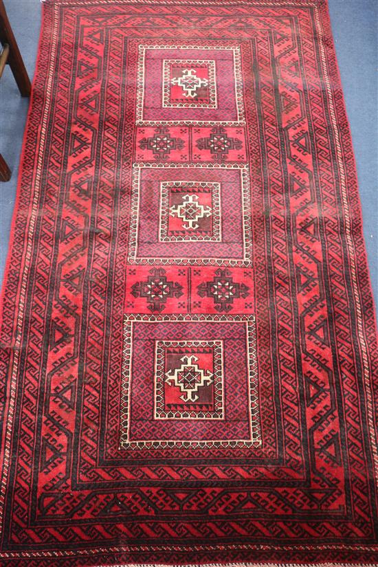 A Caucasian red ground rug, 186 x 107cm